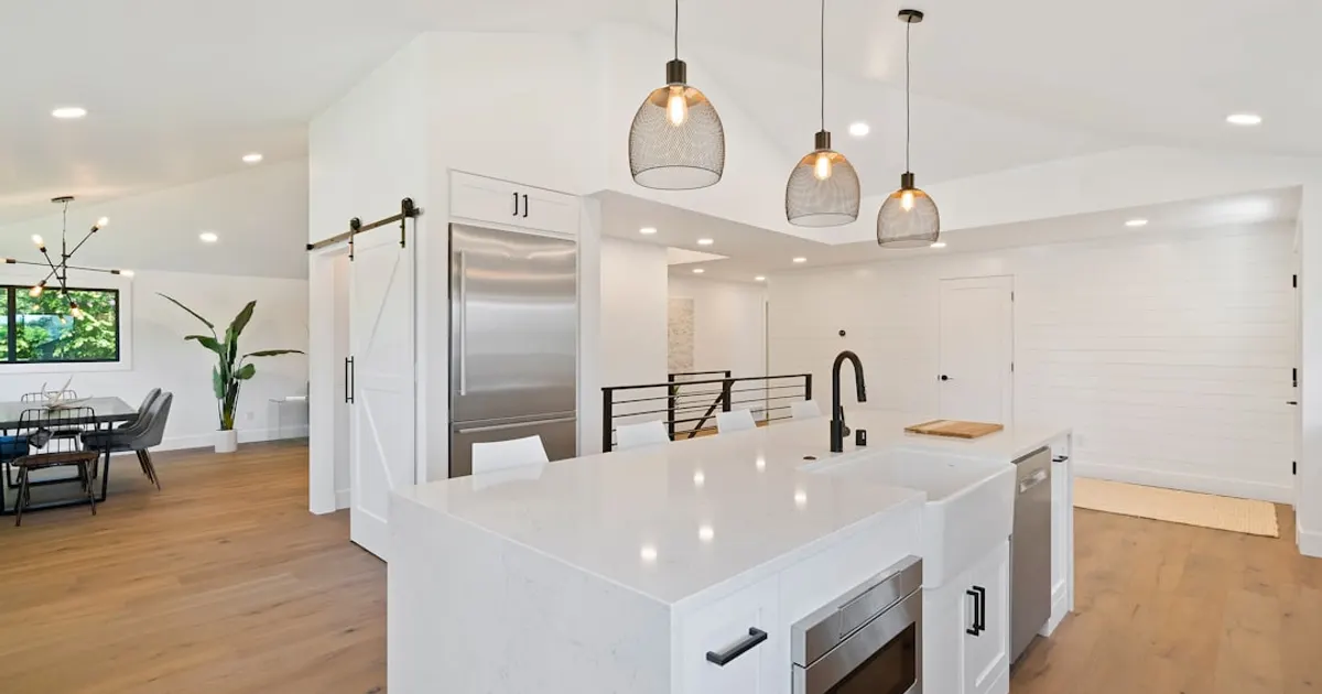 Turned on pendant lamps above kitchen island